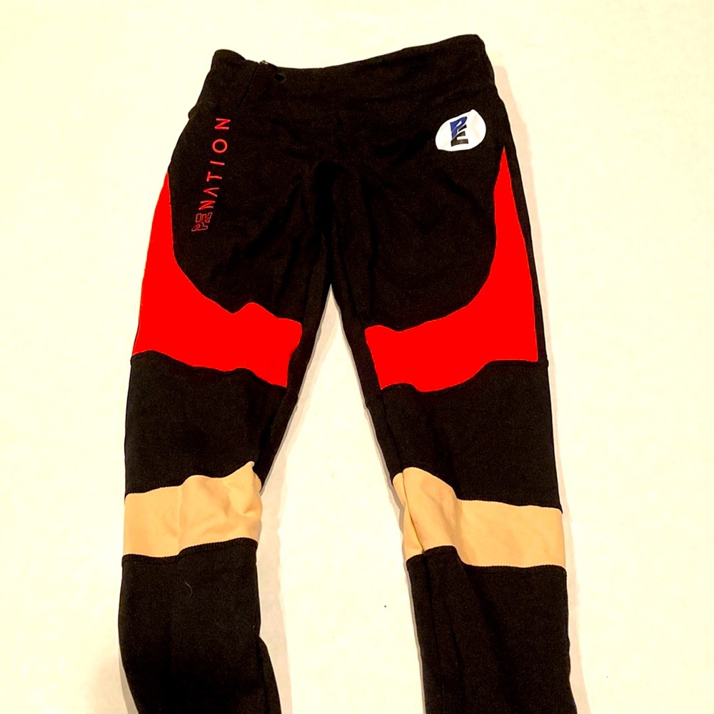 PE Nation womens black leggings with color lock details and logo